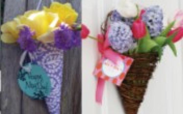 Multi colored flowers in cone shaped holders.