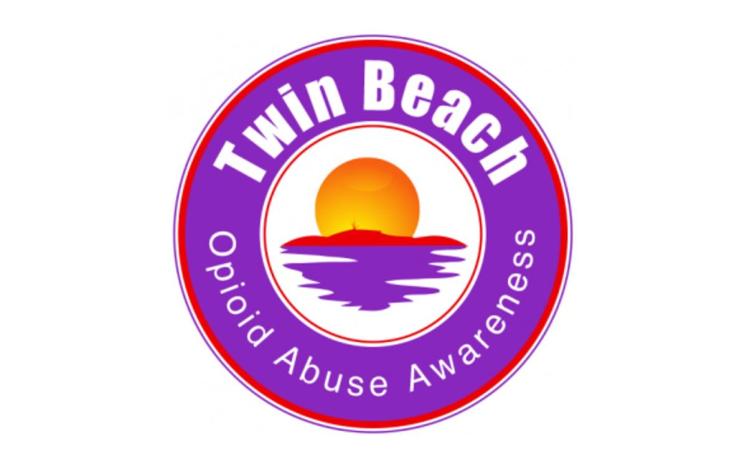 Purple circle with white letters that say Twin Beach Opioid Abuse Awareness.